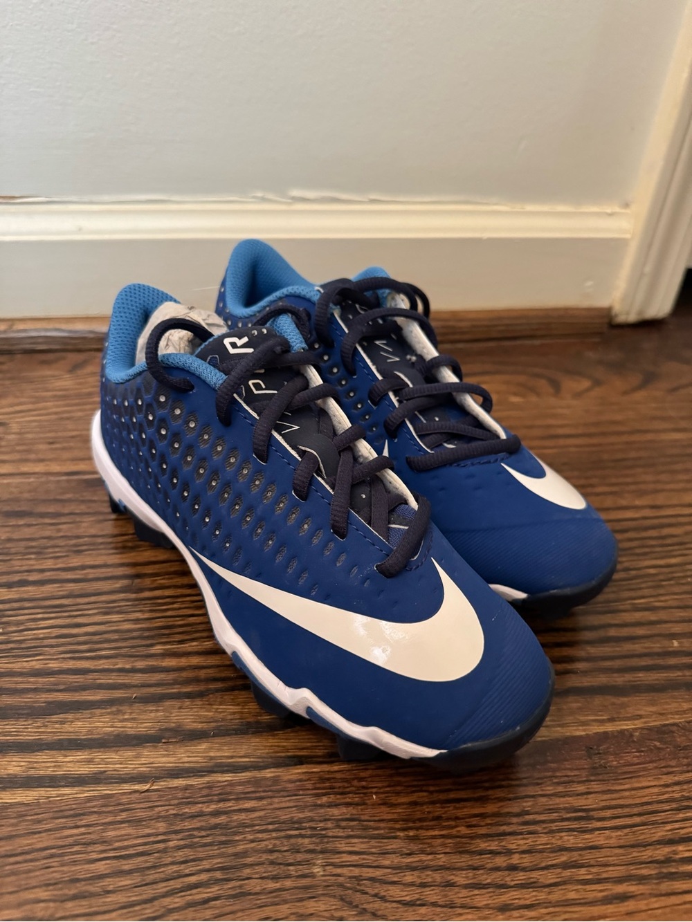 Nike Kids Blue Cleats with White Swoosh